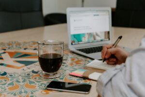 Professional reviewing paperwork and notes at a desk for a trademark office action response